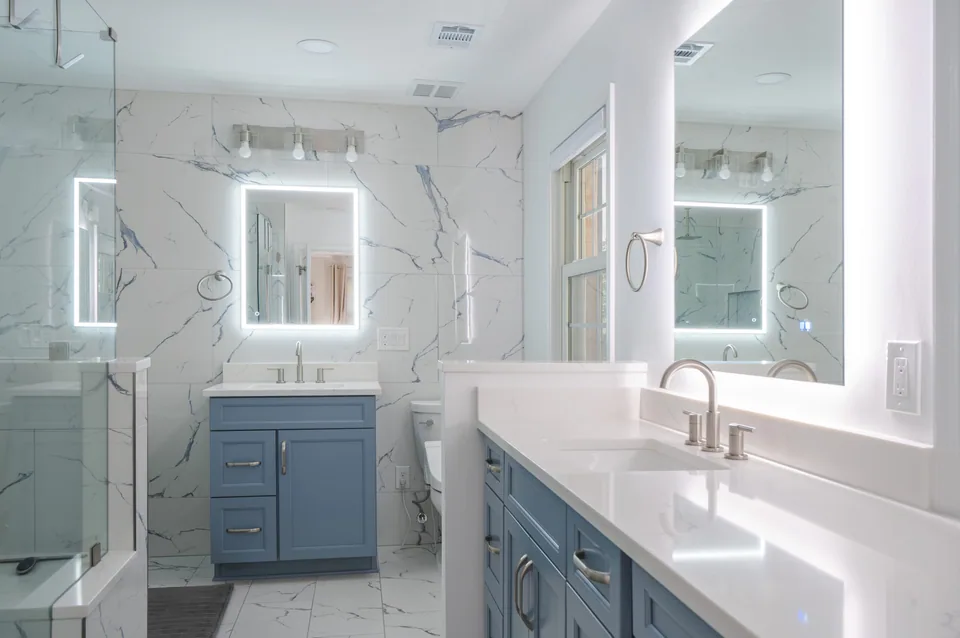 Modern bathroom remodel with large walk-in shower and wood vanity