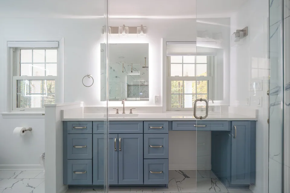 Bathroom remodeling project with a custom vanity and glass shower enclosure