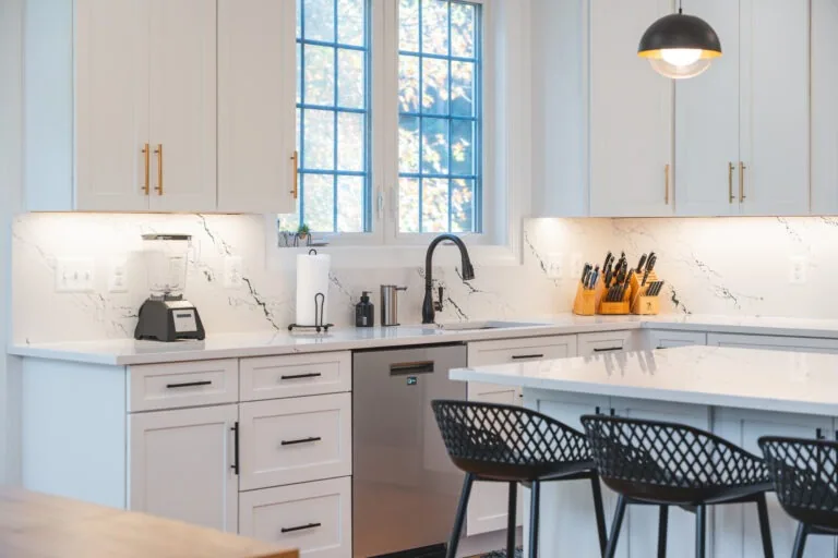 Kitchen renovation project with a bright window wall and island seating