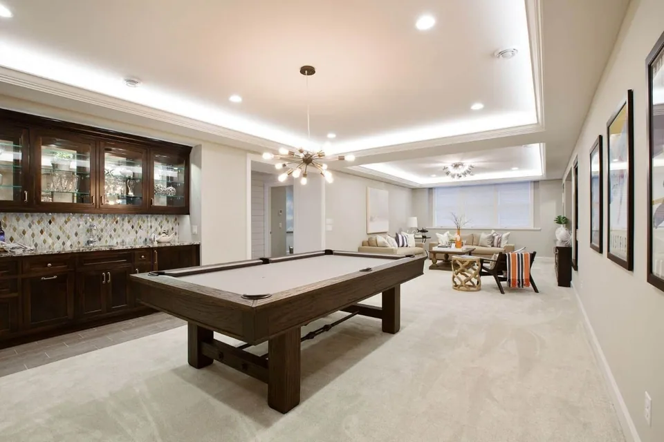 Basement remodeling service showcase with a finished lower-level space